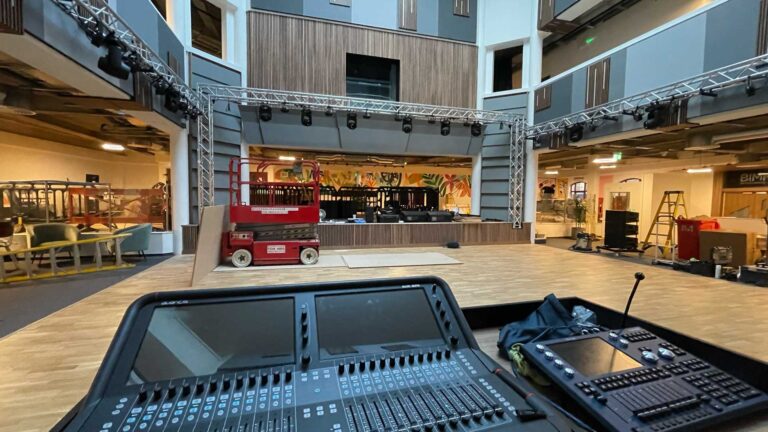 Live music venue with a mixing desk in the foreground